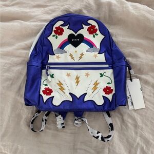 State Bags Kane Kids Double Pocket Backpack “Metallic Cowgirl” Purple NEW NWT